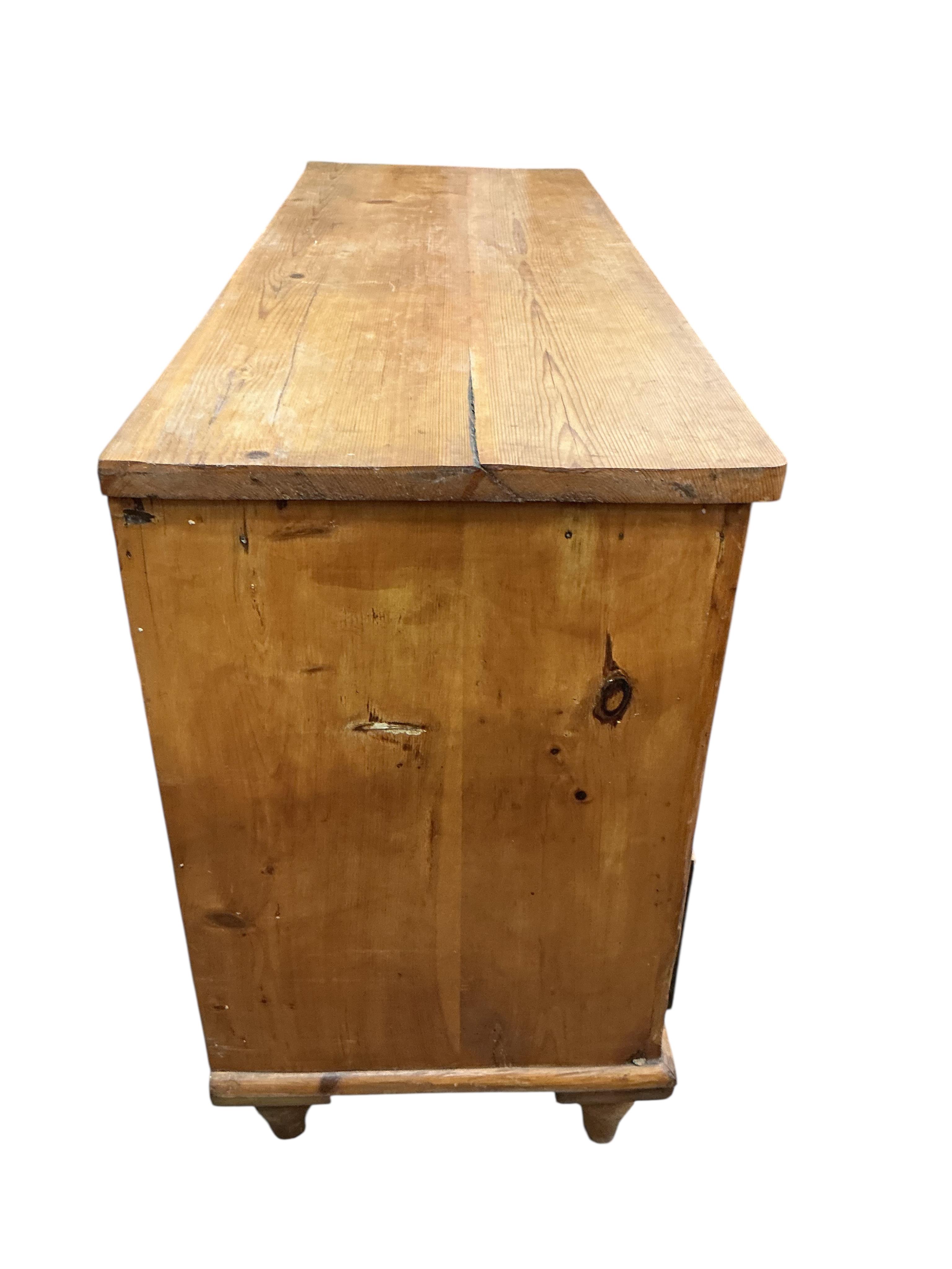 A late Victorian pine six drawer low dresser, width 132cm, depth 47cm, height 82cm